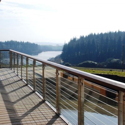 View from decked veranda overlooking water and trees