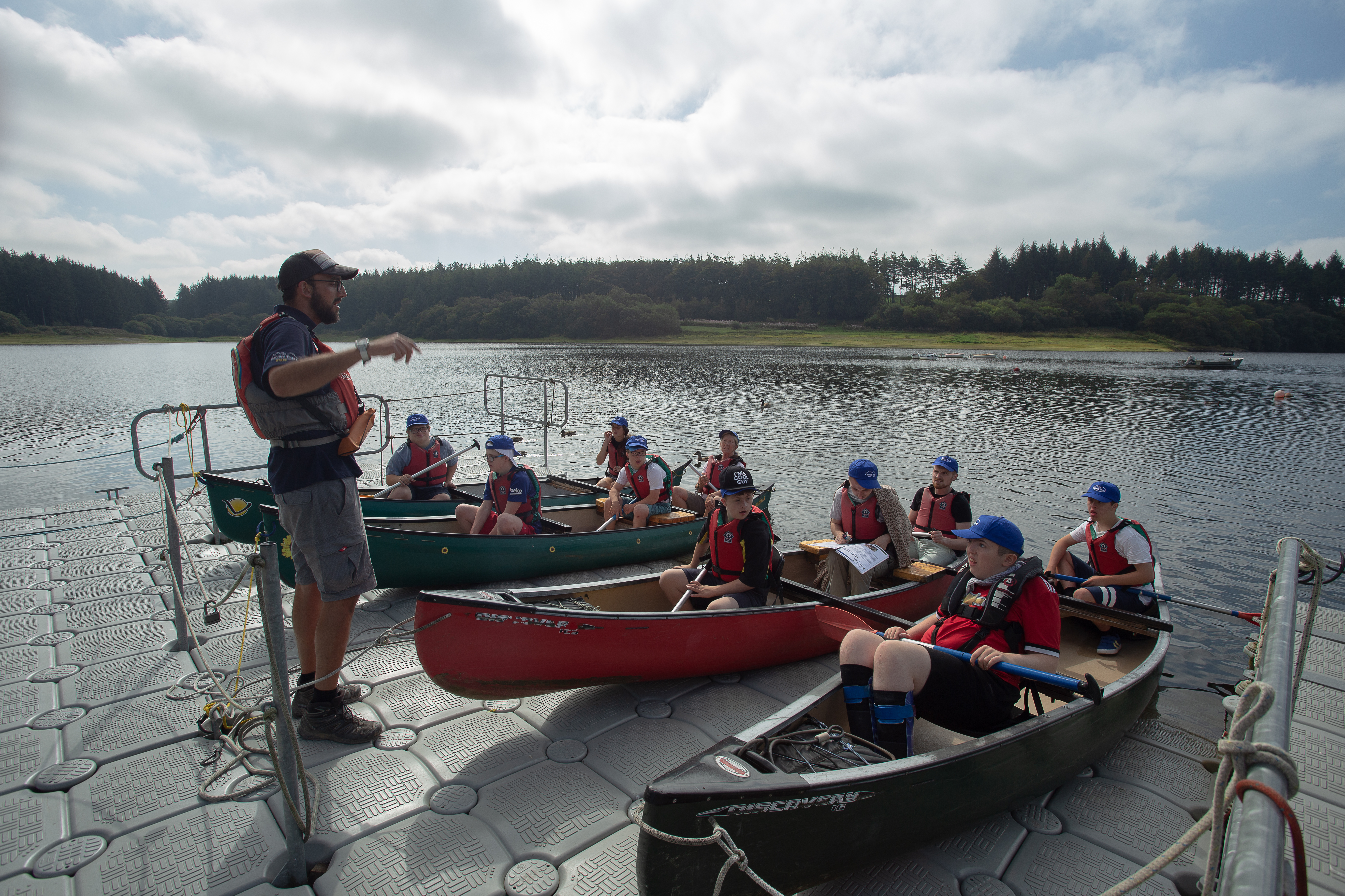 An instructor telling children how to canoe at Calvert Exmoor