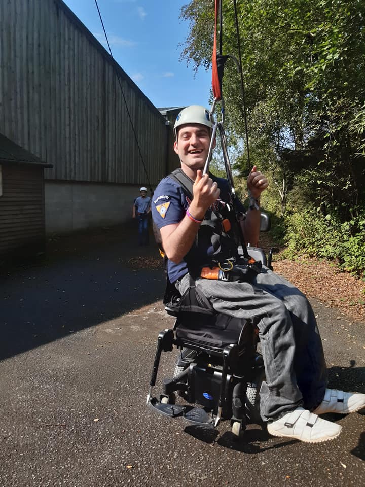 A wheelchair user with climbing hoists