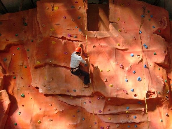Someone on the indoor CTE climbing wall