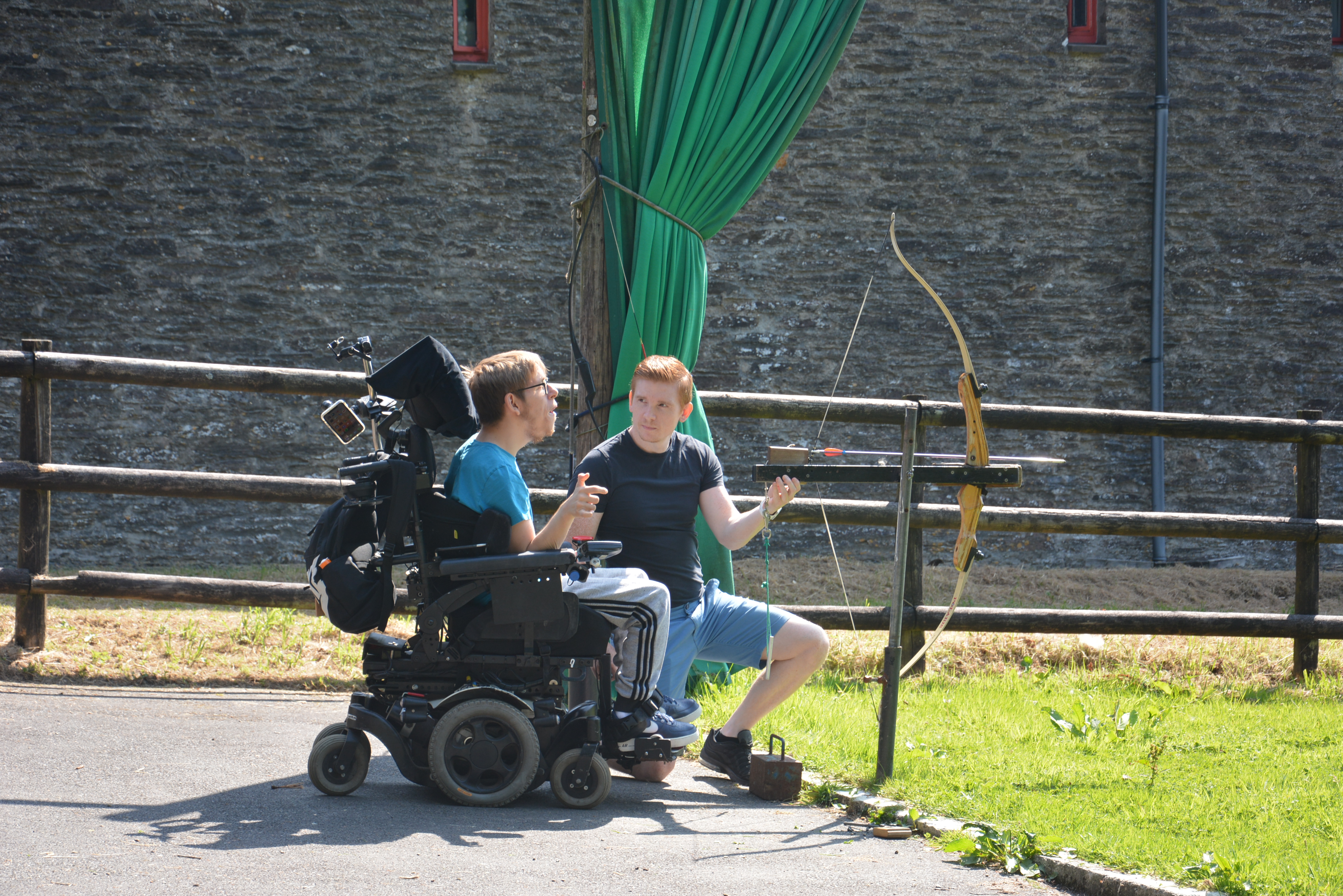 A wheelchair user trying archery at Calvert Trust