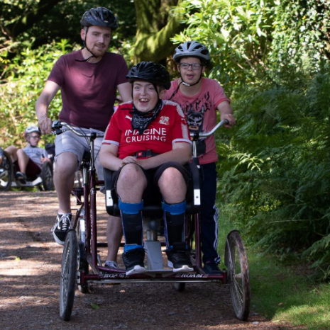 A wheelchair user using one of Calvert Trust’s specialist bicycle 